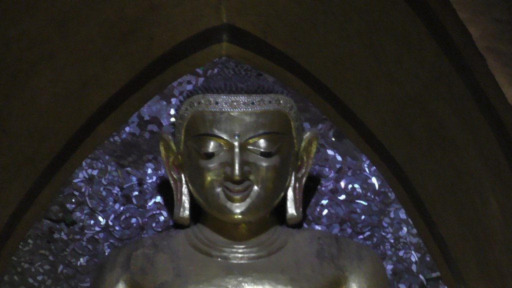 The Buddha in Ananda temple smiles from remote. 